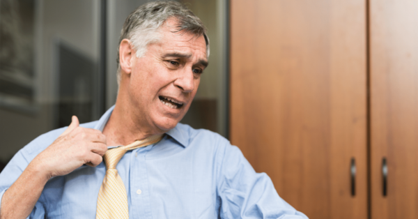 AN older man who is sweating.